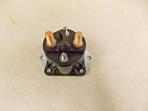 Close-up of an electrical relay with copper terminals.