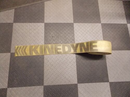 White tape with the text 'KINEDYNE' printed in yellow.