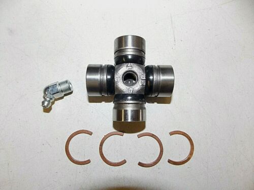 Universal joint with clips and grease fitting on a white surface.