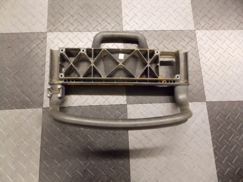 A vintage metal door handle with a latch mechanism.