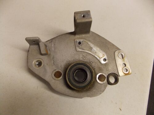 Metal mechanical component with mounting holes and a central bearing.