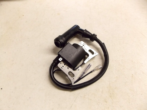 Ignition coil with wire and connector on a light surface.